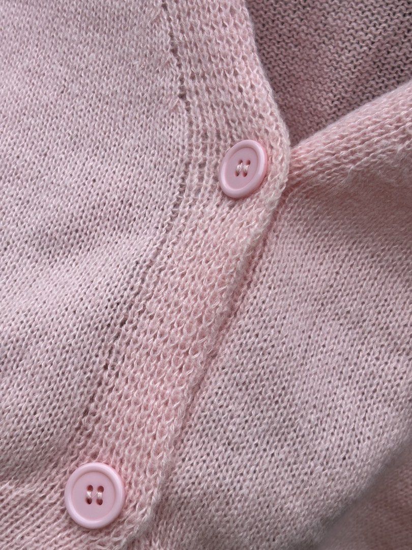 Pink Crop Knit Cardigan (Category: Coats, Jackets and Outerwear) located in Manila. Submitted by kszortpdrss (Listing ID 1471156768, Image 2). Description: - Color: Light Pink - Style: Cropped cardigan with V-neck and front button closure - Details: Long sleeves with ribbed cuffs and hem - Material: Soft, cozy knit texture - Versatility: Perfect layering piece for air-conditioned rooms or cooler weather - Condition: Excellent / Like new.