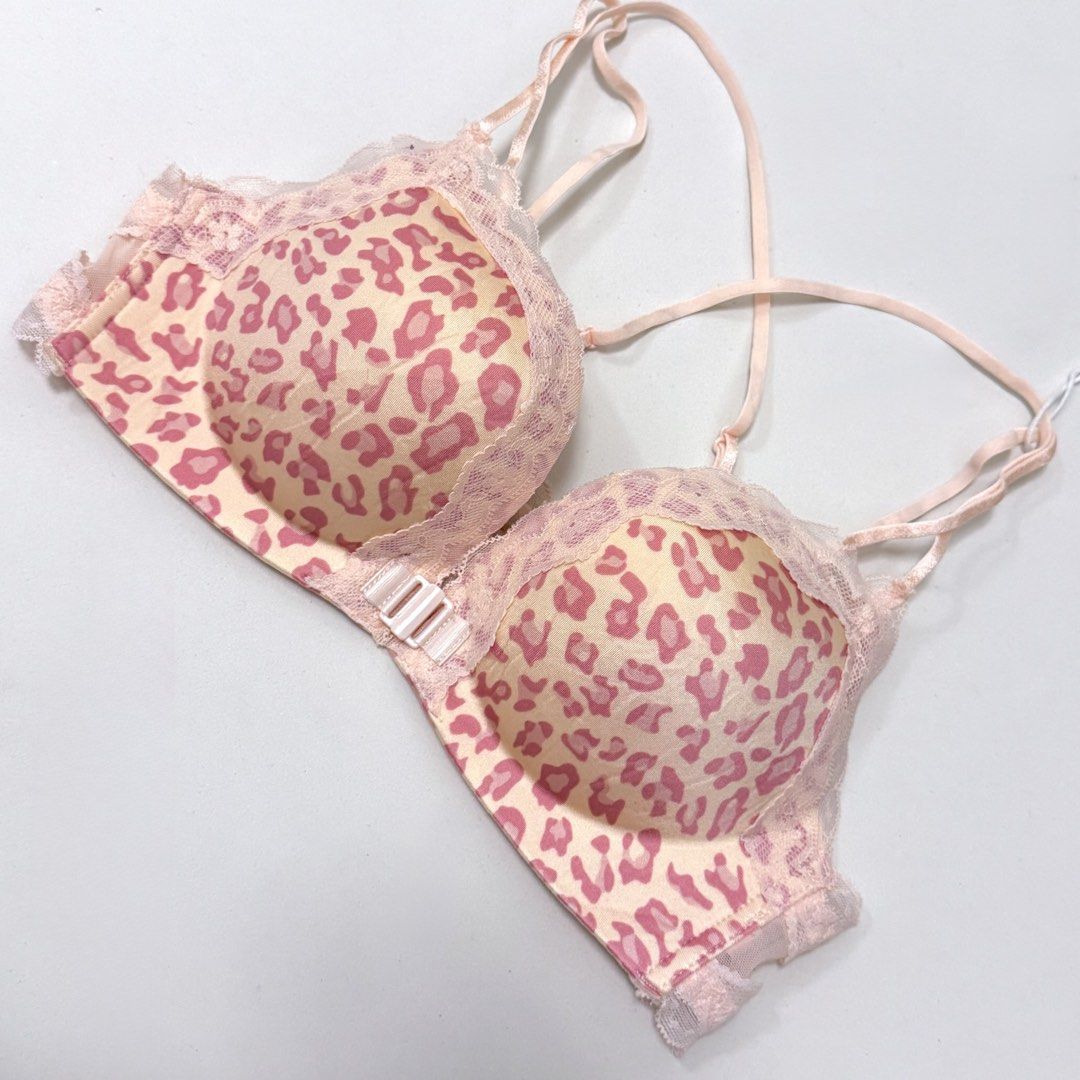 Pink Leopard Print Front-Closure Push-up Bra [34B] (Category: Undergarments & Loungewear) located in Malabon City. Submitted by k_intimates (Listing ID 1471287071, Image 3). Description: Details: • Size 34B / wireless / push-up • Bnew, but it has a very light blue stain at the mesh part and left cup (check last photo) • Pink leopard-print wireless push-up bra with a front metal clasp and lace trim..