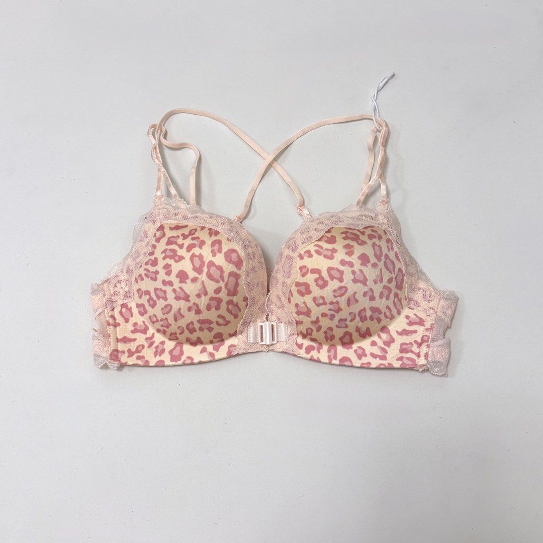 Pink Leopard Print Front-Closure Push-up Bra [34B] (Category: Undergarments & Loungewear) located in Malabon City. Submitted by k_intimates (Listing ID 1471287071, Image 2). Description: Details: • Size 34B / wireless / push-up • Bnew, but it has a very light blue stain at the mesh part and left cup (check last photo) • Pink leopard-print wireless push-up bra with a front metal clasp and lace trim..