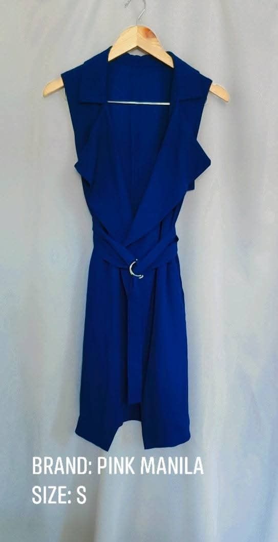 Pink Manila Blue Sleeveless Vest Size S (Category: Sleeveless) located in Bacoor. Submitted by stargazer1084 (Listing ID 1471215549, Image 1). Description: - Brand: Pink Manila - Item: Sleeveless vest - Color: Bright blue - Size: S - Design: Open front with matching waist tie and circle buckle detail - Fabric: Lightweight, ideal for layering - Condition: Clean and well-maintained.