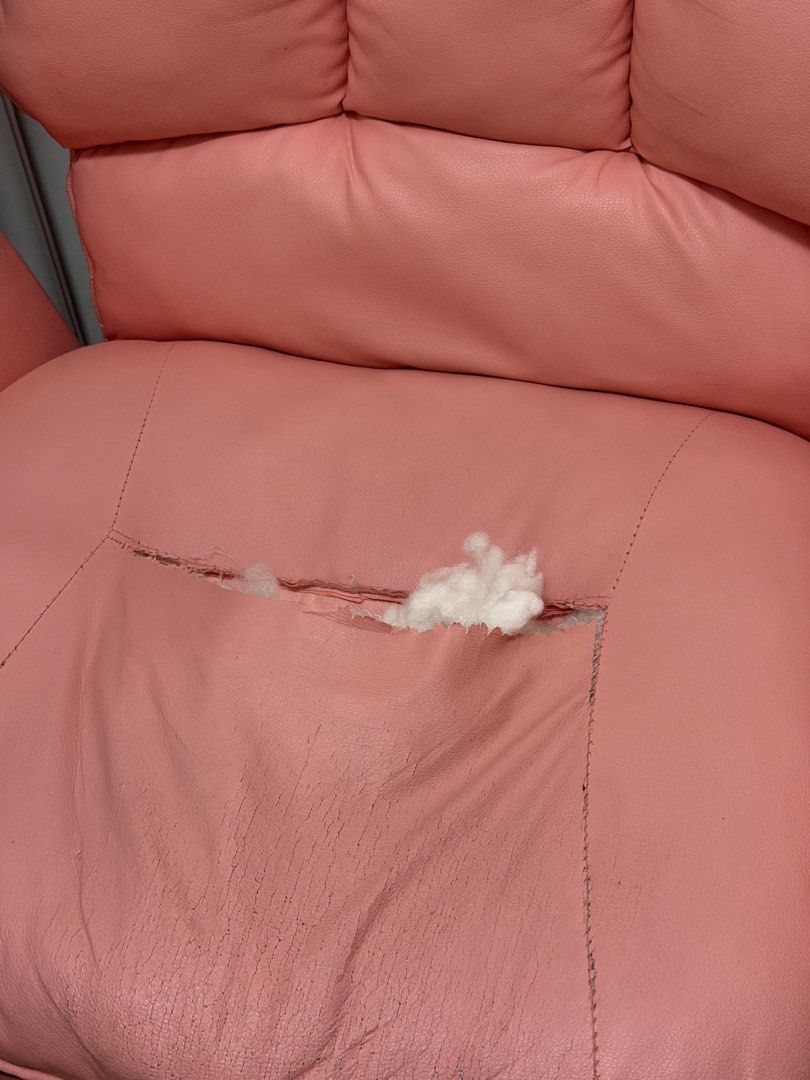 Pink office and gaming chair with padding (Category: Chairs) located in Manila. Submitted by dailee.closet (Listing ID 1471288678, Image 2). Description: - Pink rolling office chair with cushions and padded armrests - Faux leather seat is peeling badly, exposing the inner stuffing (needs a slipcover or patch) - Sturdy metal base with wheels - Has a foldable footrest attachment - Still spins and rolls perfectly.