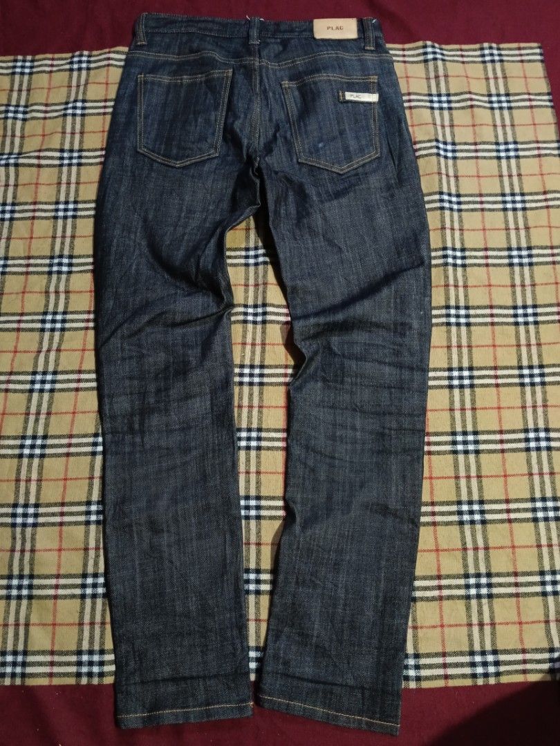 PLAC Dark Wash Denim Jeans Size 31 (Category: Jeans) located in General Santos City (Dadiangas). Submitted by freehorse.5f2a61 (Listing ID 1471226736, Image 2). Description: - Brand: PLAC - Style: Dark wash straight leg denim jeans - Size: 31 (indicated on inner tag) - Material: Comfortable cotton, polyester, and polyurethane blend - Details: Orange contrast stitching, back waistband leather patch, and branded rear pocket tag - Condition: Excelle