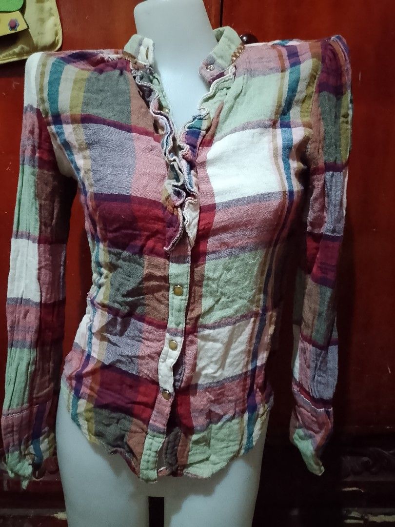 Plaid Long Sleeve Button Down Blouse Size M (Category: Longsleeves) located in Batangas. Submitted by sheenx.09 (Listing ID 1471222740, Image 1). Description: - Brand/Style: APM Reform flannel button-down shirt ♥️ - Pattern: Multi-color pastel plaid (pink, green, white, burgundy) - Size: Medium on tag (s to m) - Details: Long sleeves, collared neck with small metal buttons, and a trendy ruffled front placket 😉 - Condition: Excellent, tag attache