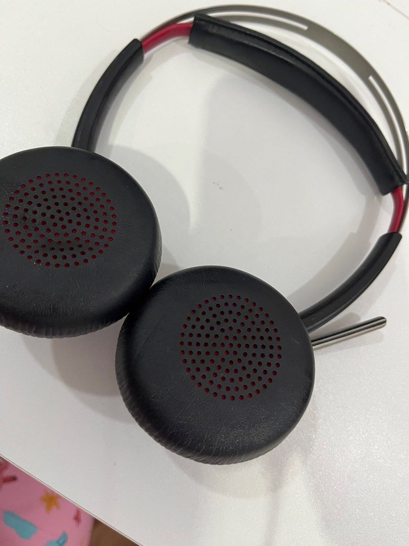 Plantronics Wireless On-Ear Headset with Mic (Category: Headphones & Headsets) located in Rizal. Submitted by oncelove143 (Listing ID 1471140953, Image 3). Description: - Brand: Plantronics - Style: Over-ear headphones in black with stylish silver headband accents and red ear cup interior mesh - Comfort: Highly cushioned ear pads and padded headband for all-day wear - Audio & Mic: Built-in boom microphone arm on the left side for clear office cal