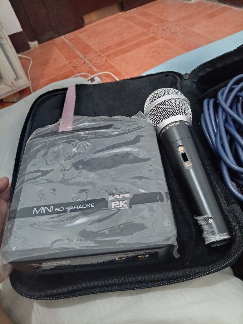 Platinum Mini SD Karaoke Set with Microphone and Case (Category: Soundbars, Speakers & Amplifiers) located in Caloocan City. Submitted by maynaito (Listing ID 1471283496, Image 2). Description: - Product: Platinum Mini SD Karaoke unit - Case: Durable black padded storage bag for easy portability - Inclusions: Wired microphone, power adapter, remote control, and extra cables - Condition: Complete set and ready to use - Best for: Home entertainment