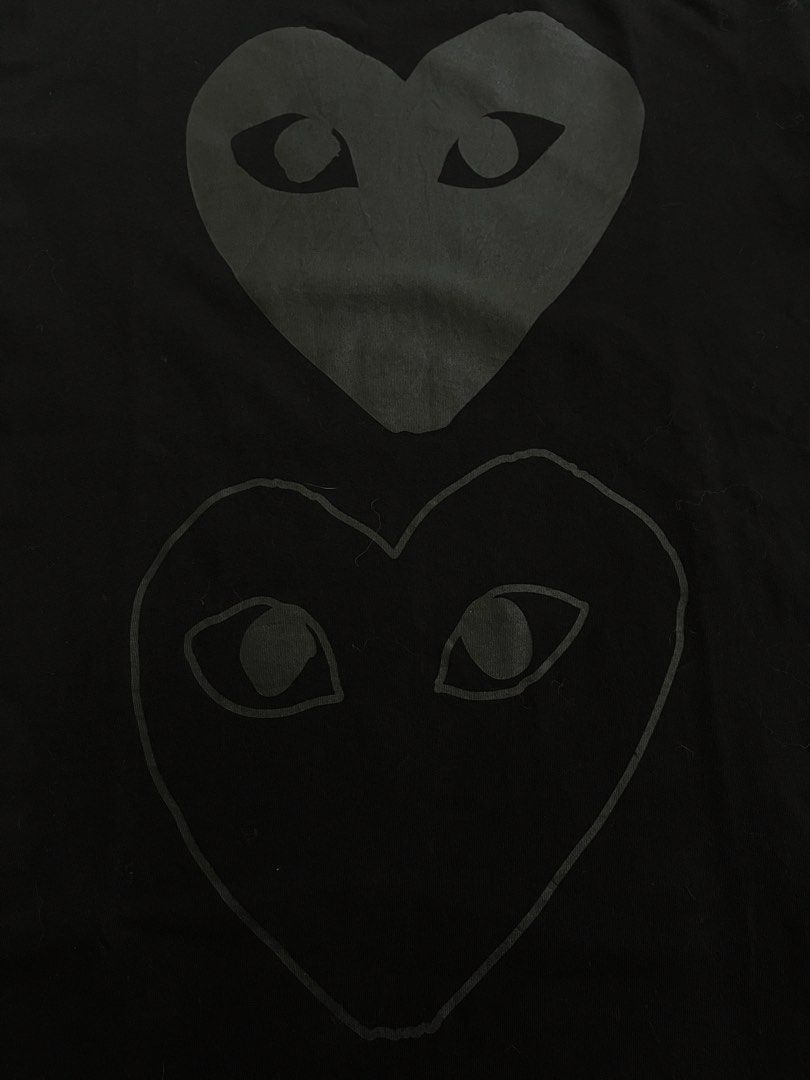 Play Comme des Garcons Double Heart Tee Black Size L (Category: Shirts) located in Manila. Submitted by halukays (Listing ID 1471191844, Image 2). Description: - Brand: Play Comme des Garcons - Color: Black - Size: Large - Design: Tonal black and grey double heart graphic on chest, large logo text on lower back - Material: Premium cotton jersey with crew neckline - Condition: Clean, worn just a few times Size Medium Width 20 Length 26 Color rate 