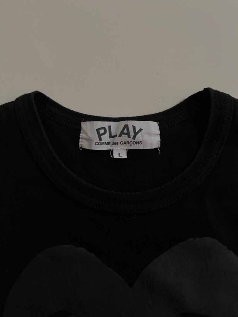 Play Comme des Garcons Double Heart Tee Black Size L (Category: Shirts) located in Manila. Submitted by halukays (Listing ID 1471191844, Image 3). Description: - Brand: Play Comme des Garcons - Color: Black - Size: Large - Design: Tonal black and grey double heart graphic on chest, large logo text on lower back - Material: Premium cotton jersey with crew neckline - Condition: Clean, worn just a few times Size Medium Width 20 Length 26 Color rate 