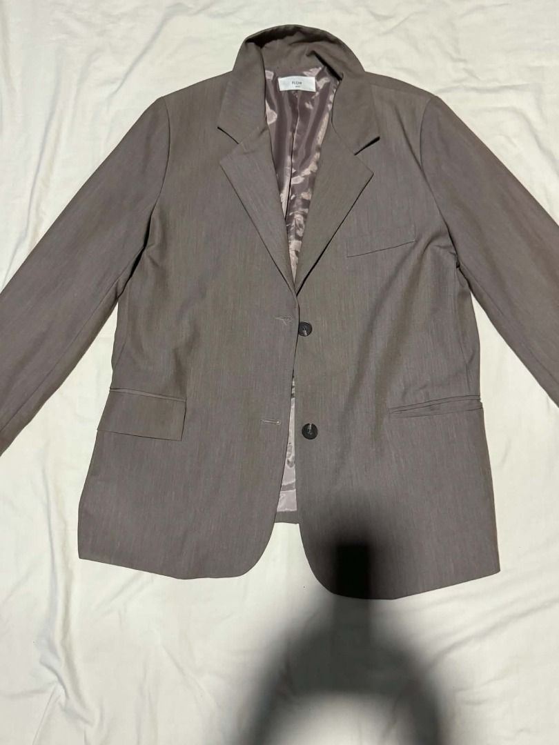 PLST Gray Suit Blazer Jacket (Category: Coats, Jackets and Outerwear) located in Caloocan City. Submitted by deo0215 (Listing ID 1471134532, Image 1). Description: - Brand: PLST - Color: Classic Gray - Style: Tailored office blazer with structured lapel collar - Closure: Two-button front - Pockets: Functional front flap pockets - Details: Chic patterned inner lining and decorative cuff buttons - Versatility: Easy to match with trousers or skirts 
