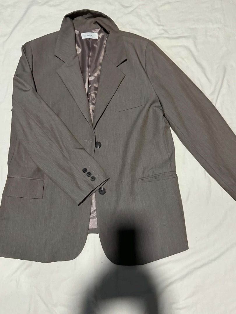 PLST Gray Suit Blazer Jacket (Category: Coats, Jackets and Outerwear) located in Caloocan City. Submitted by deo0215 (Listing ID 1471134532, Image 2). Description: - Brand: PLST - Color: Classic Gray - Style: Tailored office blazer with structured lapel collar - Closure: Two-button front - Pockets: Functional front flap pockets - Details: Chic patterned inner lining and decorative cuff buttons - Versatility: Easy to match with trousers or skirts 