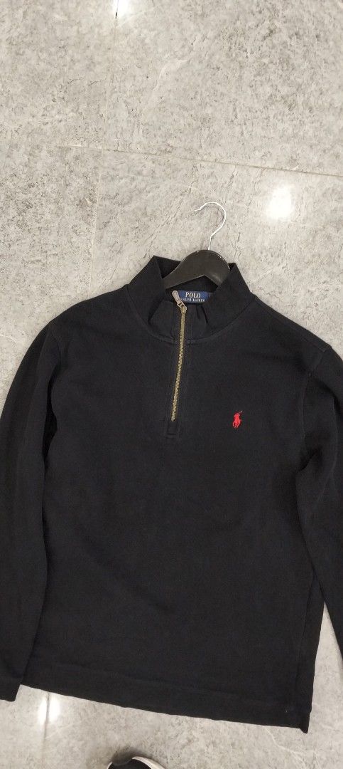 Polo Ralph Lauren Black Quarter Zip Pullover (Category: Coats, Jackets and Outerwear) located in Bacolod City. Submitted by hurleydediamante0513 (Listing ID 1471151792, Image 2). Description: - Brand: Polo Ralph Lauren - Color: Classic Black with Red Embroidered Pony Logo - Style: Quarter-zip sweater with mock neck and metallic zipper pull - Material: Soft and comfortable cotton knit - Details: Ribbed cuffs and hem - Condition: Clean, great pre-l