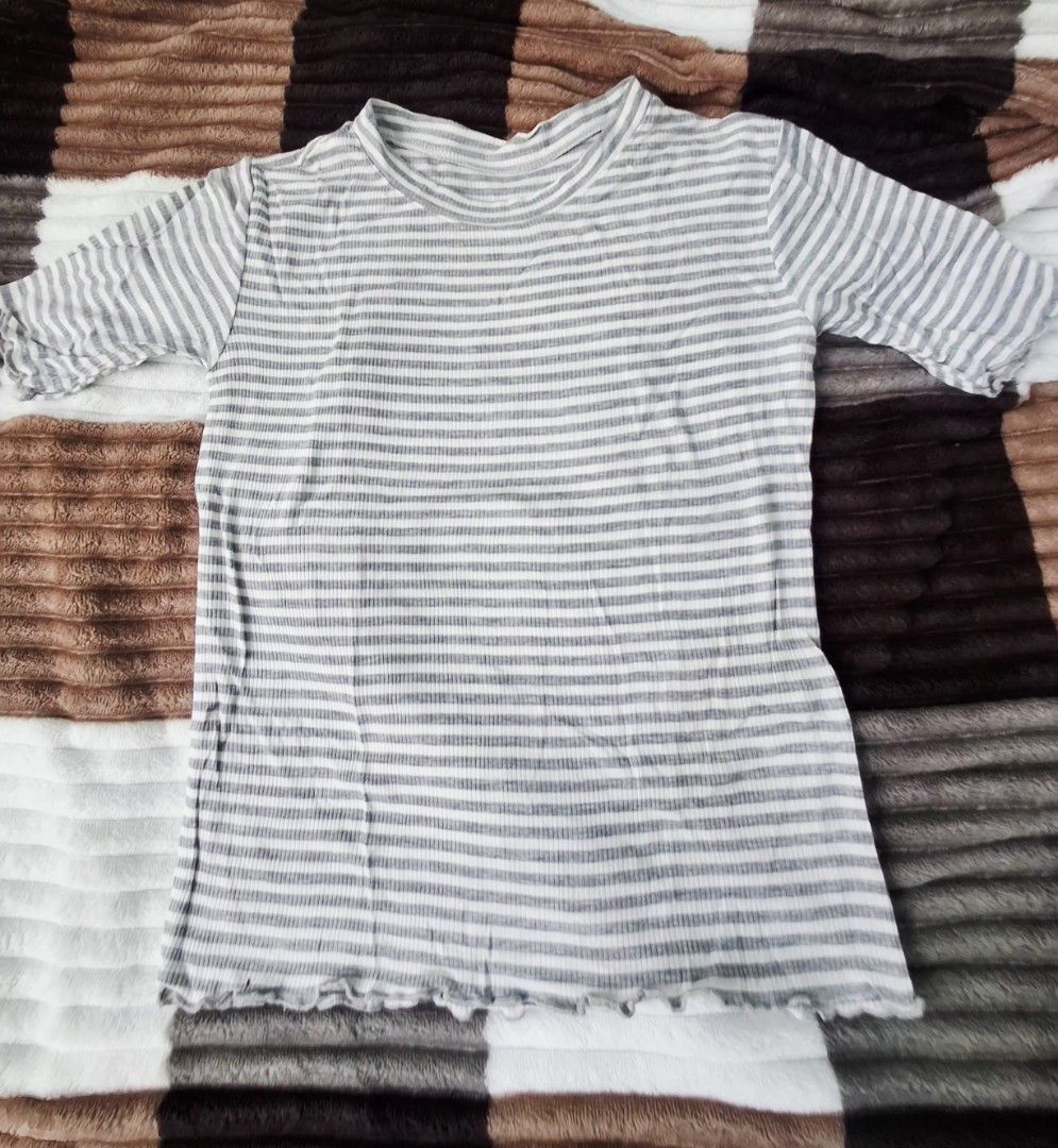 Polo shirts and Crop top (Category: Shirts) located in Angeles City. Submitted by cloudzies041456 (Listing ID 1471128694, Image 1). Description: Peach ribbed polo shirt from Zara. Short sleeves with a button placket at the neckline. Fitted cut through the body. Soft ribbed knit fabric with stretch. Neutral tone goes with everything. Easy to style with high-waisted jeans or skirts. Clean condition inside and out..