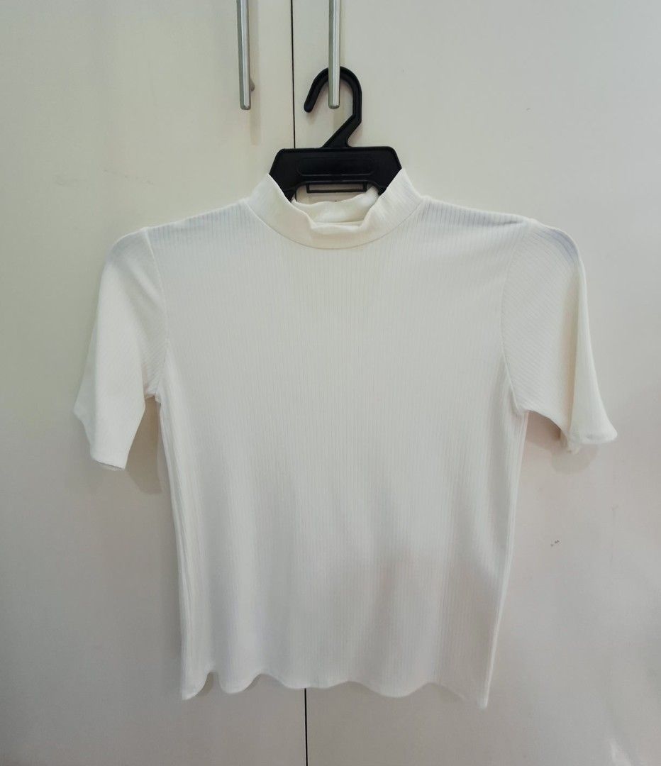 Polo shirts and Crop top (Category: Shirts) located in Angeles City. Submitted by cloudzies041456 (Listing ID 1471128694, Image 3). Description: Peach ribbed polo shirt from Zara. Short sleeves with a button placket at the neckline. Fitted cut through the body. Soft ribbed knit fabric with stretch. Neutral tone goes with everything. Easy to style with high-waisted jeans or skirts. Clean condition inside and out..