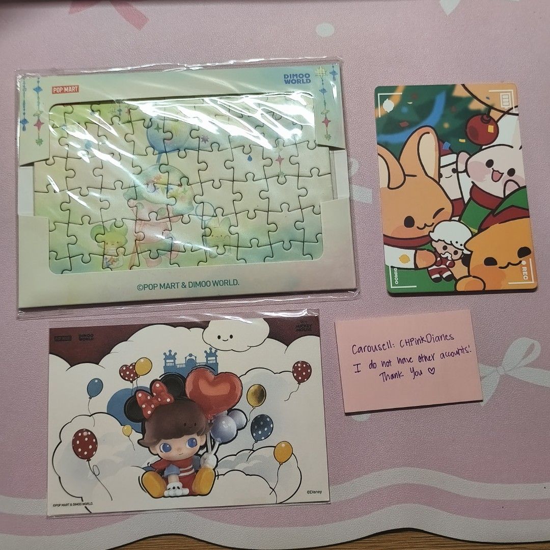 POPMART Dimoo Puzzle and Postcard Set (Category: Designer & Blind Box Toys) located in Cotabato. Submitted by chpinkdiaries (Listing ID 1471192186, Image 1). Description: NOT NEGOTIABLE. LOWBALLERS WILL BE IGNORED! ✅Condition: Sealed, puzzle and postcard still have plastics. The christmas postcard is as is ✅Includes: Wysiwyg ✅ Authentic Please check the photos for condition of the item. Item will be packed with bubble wrap. Photos before shipping