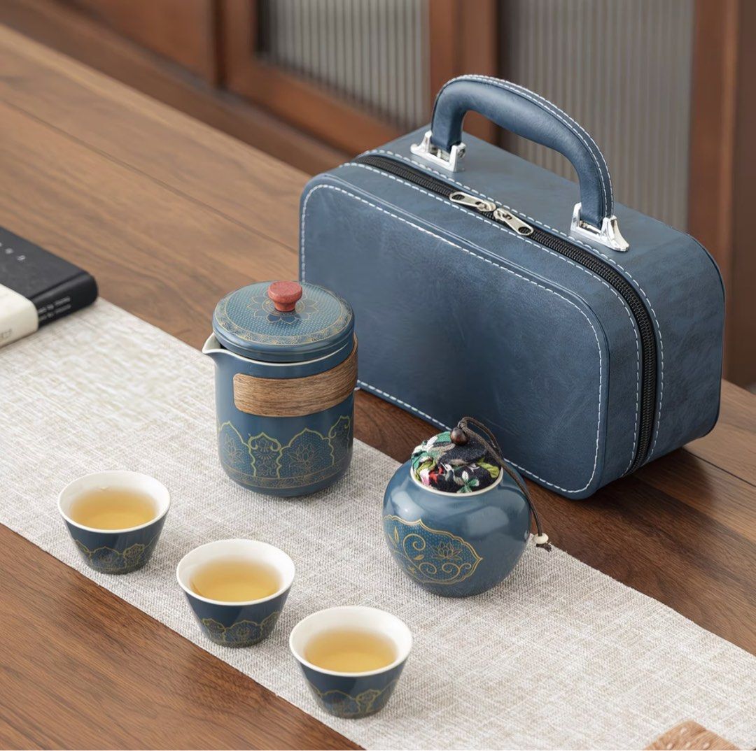 Portable Blue Ceramic Travel Tea Set with Case (Category: Coffee & Tea Tableware) located in Quezon City. Submitted by avc521 (Listing ID 1471200162, Image 3). Description: - Elegant blue ceramic tea set featuring stunning gold floral patterns - Includes 1 teapot with built-in filter, 3 matching cups, 1 tea caddy, and a versatile lid that doubles as a saucer - Comes in a durable hard shell travel case with a convenient carrying handle - Perfect f
