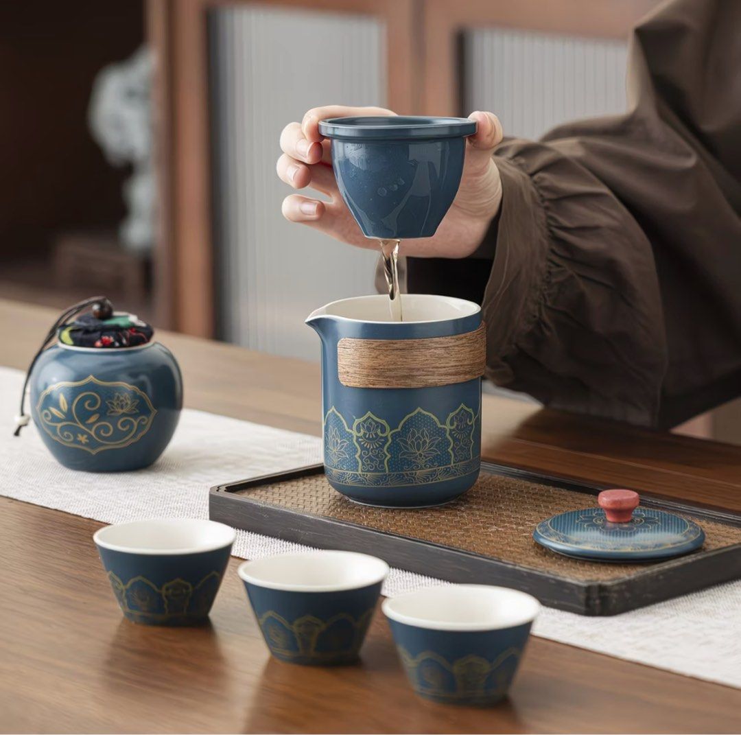 Portable Blue Ceramic Travel Tea Set with Case (Category: Coffee & Tea Tableware) located in Quezon City. Submitted by avc521 (Listing ID 1471200162, Image 1). Description: - Elegant blue ceramic tea set featuring stunning gold floral patterns - Includes 1 teapot with built-in filter, 3 matching cups, 1 tea caddy, and a versatile lid that doubles as a saucer - Comes in a durable hard shell travel case with a convenient carrying handle - Perfect f