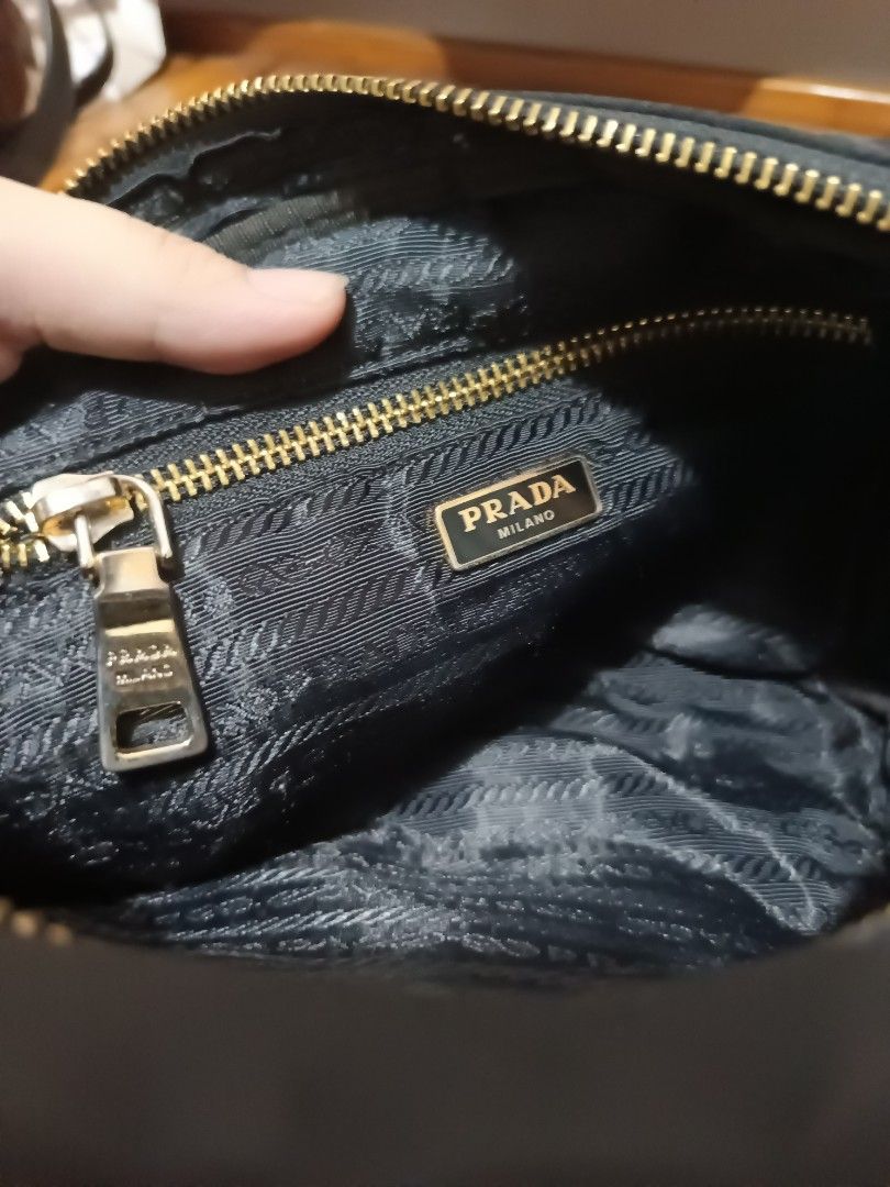 Prada Black Nylon Teddy Bear Sequin Crossbody Bag (Category: Luxury Bags & Wallets) located in Lucena. Submitted by jeankristi73450 (Listing ID 1471272303, Image 3). Description: - Prada black nylon crossbody bag - Features a sparkling sequin teddy bear design on the front - Elegant gold-tone chain strap intertwined with black fabric - Interior lined with signature Prada logo jacquard fabric - Convenient interior zipper pocket with branded pull t
