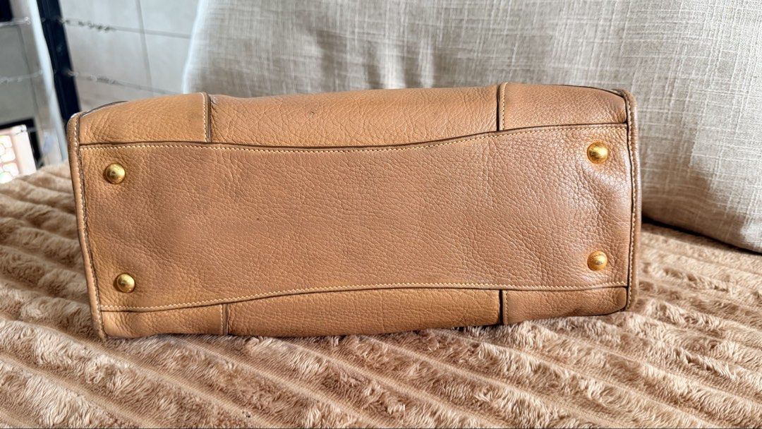 Prada Daino Leather E/W Bag (Category: Luxury Bags & Wallets) located in Rizal. Submitted by kwisee (Listing ID 1471121771, Image 3). Description: Authentic Prada leather satchel in a rich warm brown shade. Two-way bag. Photos of signs of use/flaws upon request..