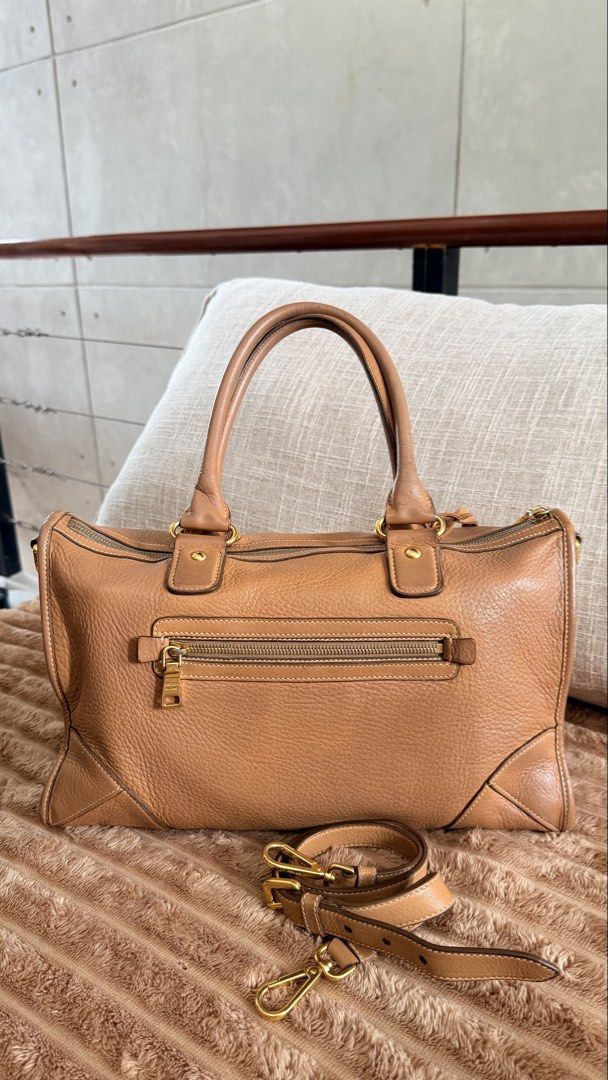 Prada Daino Leather E/W Bag (Category: Luxury Bags & Wallets) located in Rizal. Submitted by kwisee (Listing ID 1471121771, Image 2). Description: Authentic Prada leather satchel in a rich warm brown shade. Two-way bag. Photos of signs of use/flaws upon request..