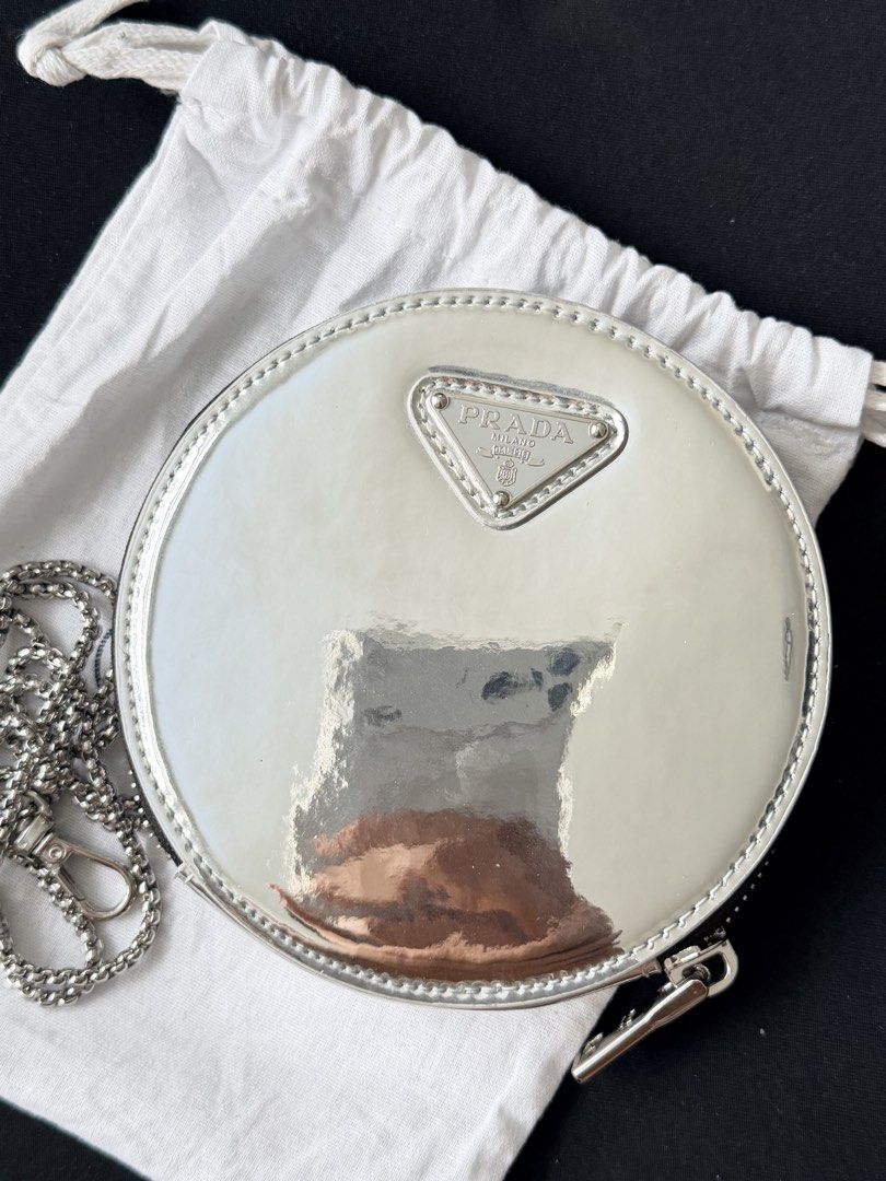 Prada Round Chain Crossbody Pouch (Category: Luxury Bags & Wallets) located in Las Pinas. Submitted by youngflower_08 (Listing ID 1471214456, Image 1). Description: Authentic prada With strap and dustbag only 9/10 condition No issue.