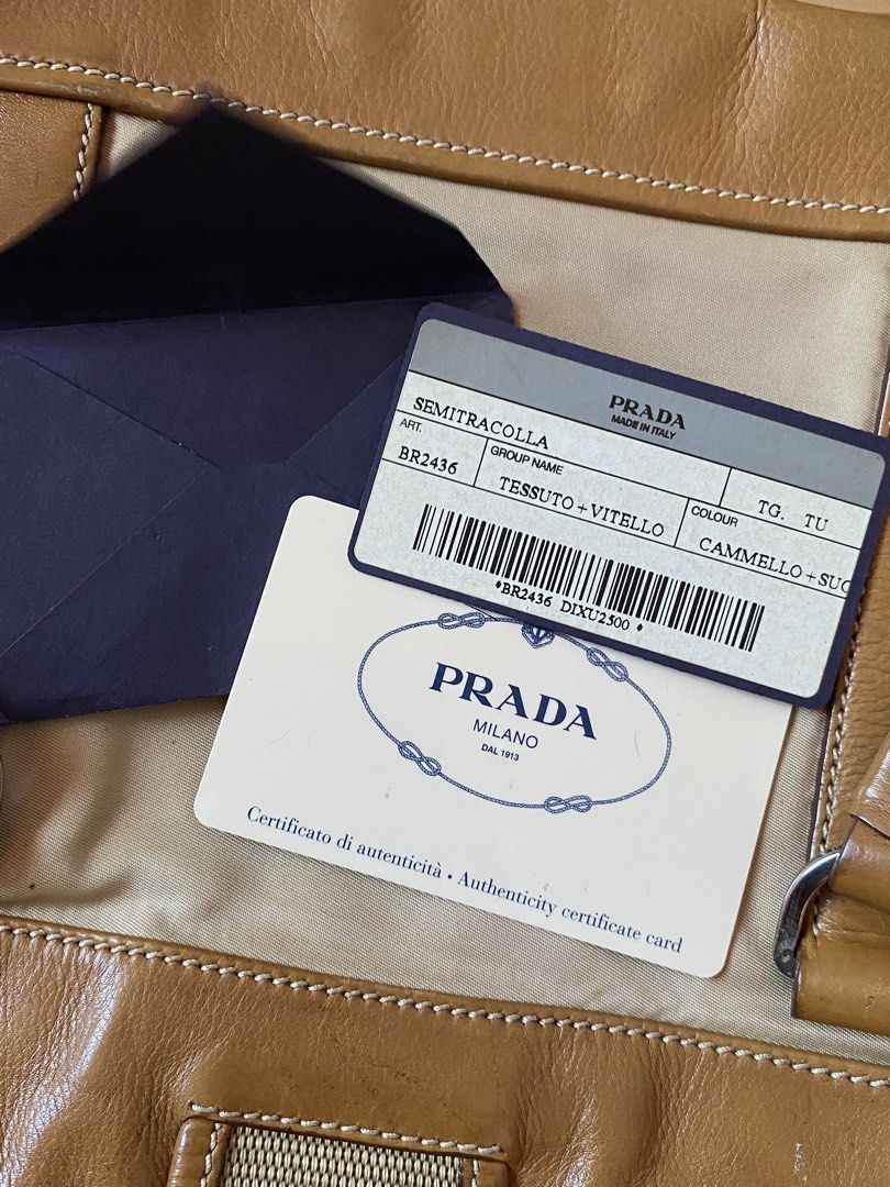 PRADA TESSUTO+VITELLO BUCKLE SHOULDER BAG (Category: Luxury Bags & Wallets) located in Binmaley. Submitted by vanilla_style (Listing ID 1471188270, Image 2). Description: Brand: Prada Color: Camel Model: Tessuto & Vitello Buckle Shoulder Bag Inclusion: CERTIFICATE OF AUTHENTICITY Condition: Good condition may mga marks lang po siya, check niyo nalang po posted naman na po lahat.☺️ DM FOR MORE PICTURES☺️.