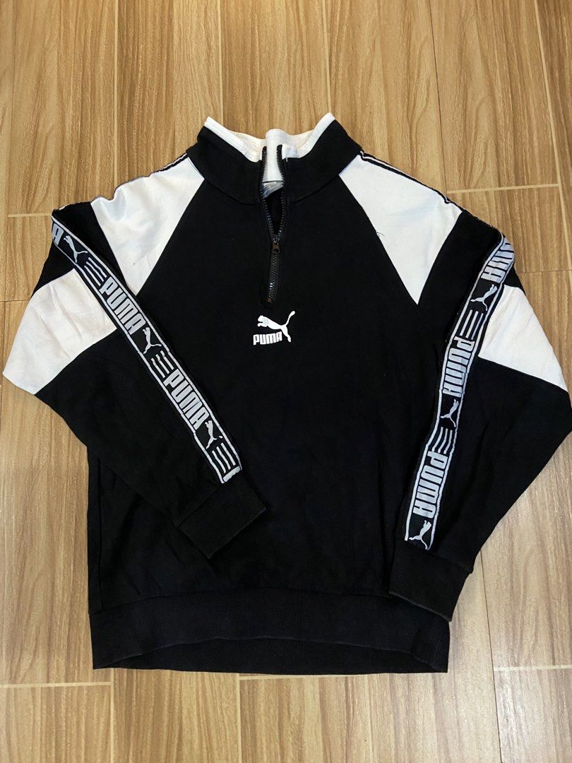 Puma Black and White Half-Zip Sweatshirt (Category: Coats, Jackets and Outerwear) located in Manila. Submitted by koolash (Listing ID 1471135728, Image 1). Description: - Brand: Puma - Style: Half-zip high neck sweatshirt - Color: Black and white with shoulder color blocking - Details: Branded tape with Puma cat logo down both sleeves - Fit: Snug ribbed cuffs and hem - Condition: Great sporty layering piece.