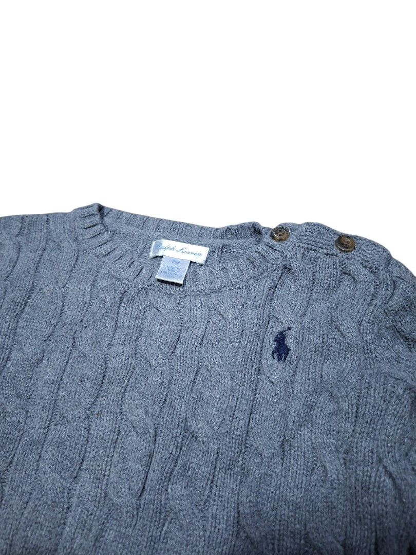 Ralph Lauren Cable Knit Grey Sweater 18M (Category: Babies & Kids Fashion) located in San Juan (Cabalian). Submitted by ec8thrift (Listing ID 1471253175, Image 2). Description: - Brand: Ralph Lauren - Size: 18 months - Color: Grey with navy blue embroidered polo logo - Material: Soft, warm knit - Design: Classic cable knit, crewneck - Feature: Shoulder button closure for easy changing - Finish: Ribbed hem and cuffs.