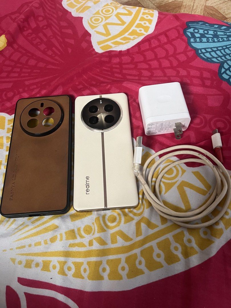 Realme 12 pro plus 5g (Category: Android Others) located in Manila. Submitted by jellynlega12838 (Listing ID 1471159877, Image 2). Description: For sale Realme 12 Pro Plus 5g 11,500 only No issue and no history repair Makinis my case marked lng natural sa 2ng hand Sobrang linaw ng camera Unit, case and charger 24gb ram (12+12) 512gb rom 6.7-inch FHD+ AMOLED Display with Reinforced Glass 120Hz Refresh Rate IP65 dust & water resistant Qualcomm Snap