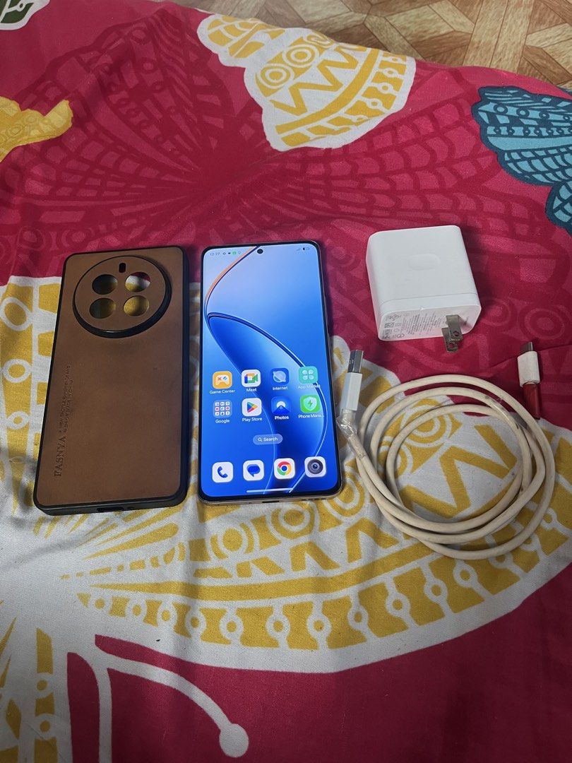 Realme 12 pro plus 5g (Category: Android Others) located in Manila. Submitted by jellynlega12838 (Listing ID 1471159877, Image 1). Description: For sale Realme 12 Pro Plus 5g 11,500 only No issue and no history repair Makinis my case marked lng natural sa 2ng hand Sobrang linaw ng camera Unit, case and charger 24gb ram (12+12) 512gb rom 6.7-inch FHD+ AMOLED Display with Reinforced Glass 120Hz Refresh Rate IP65 dust & water resistant Qualcomm Snap