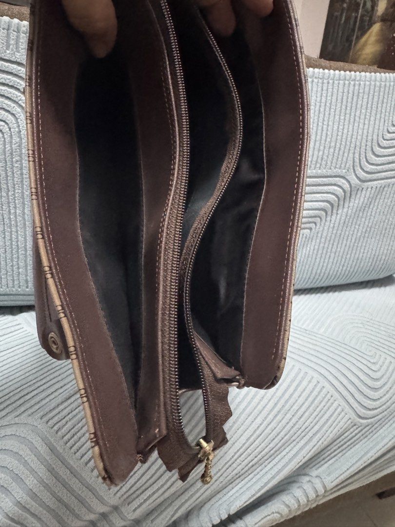 Rebika Monogram Tote Bag Brown Handbag (Category: Tote Bags) located in Imus. Submitted by budolfindsimus (Listing ID 1471256830, Image 2). Description: 🤎 AB Monogram Tote - Old Money Vibes! Pang office / pang mayaman aesthetic ✨ AB monogram pattern + brown leather handles + gold hardware Details: 📏 Medium-kasya tablet / documents 🤎 3 compartments - organized! ✨ May zipper sa likod + magnetic closure sa loob 👛 Clean inside - black lining 💼 S