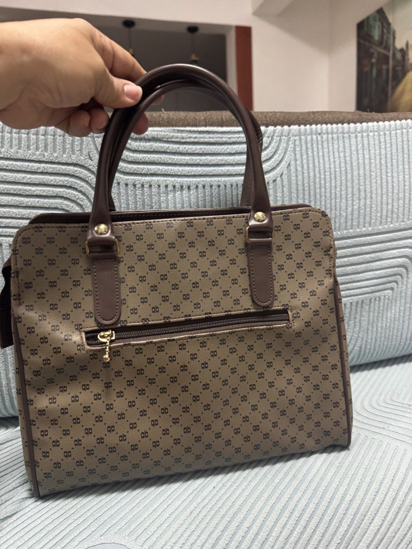 Rebika Monogram Tote Bag Brown Handbag (Category: Tote Bags) located in Imus. Submitted by budolfindsimus (Listing ID 1471256830, Image 3). Description: 🤎 AB Monogram Tote - Old Money Vibes! Pang office / pang mayaman aesthetic ✨ AB monogram pattern + brown leather handles + gold hardware Details: 📏 Medium-kasya tablet / documents 🤎 3 compartments - organized! ✨ May zipper sa likod + magnetic closure sa loob 👛 Clean inside - black lining 💼 S