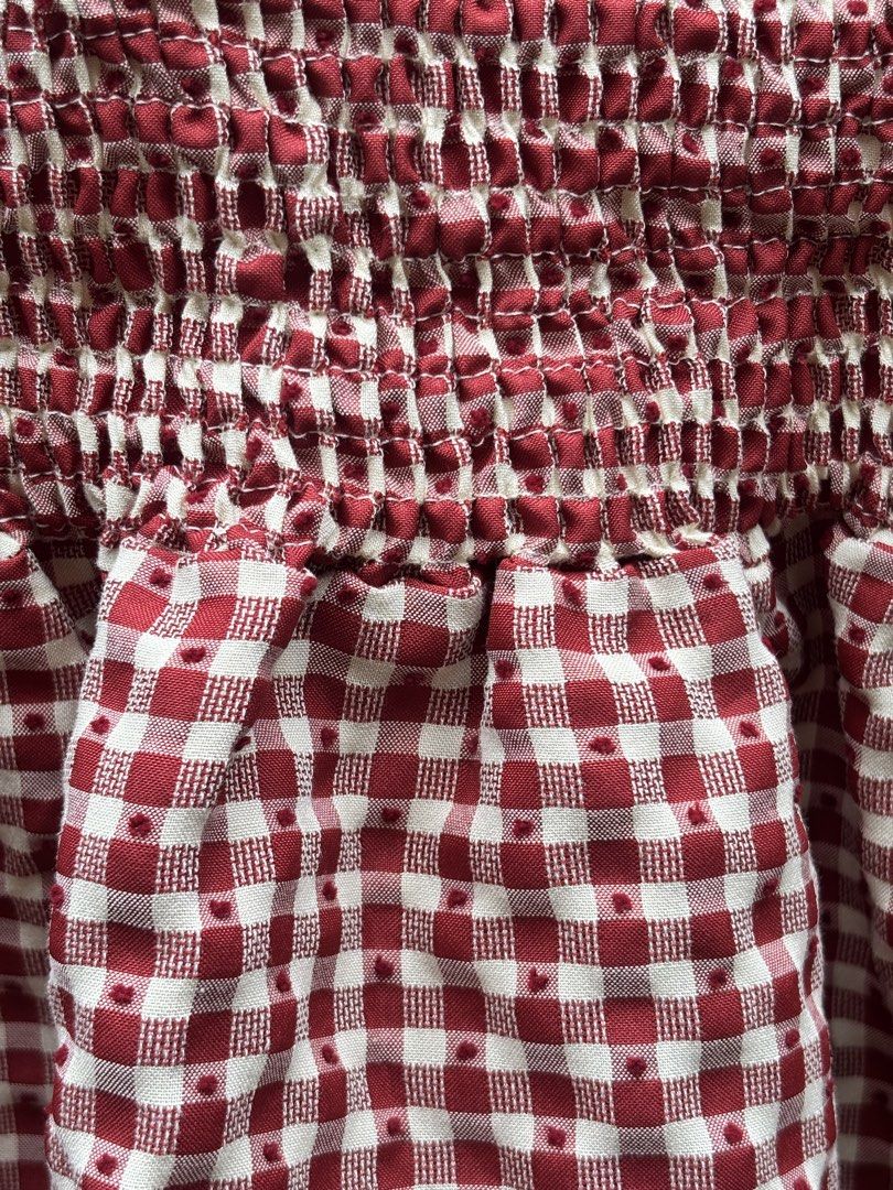 Red White Gingham Checkered Smocked Ruffle Mini Dress (Category: Dresses) located in Manila. Submitted by kszortpdrss (Listing ID 1471156684, Image 2). Description: - Classic red and white gingham checkered pattern - Comfortable smocked bodice with great stretch - Trendy layered ruffle skirt style - Sleeveless design, ideal for warm weather - Lightweight fabric with cute textured dots throughout - Perfect, stylish look for picnics and casual outi