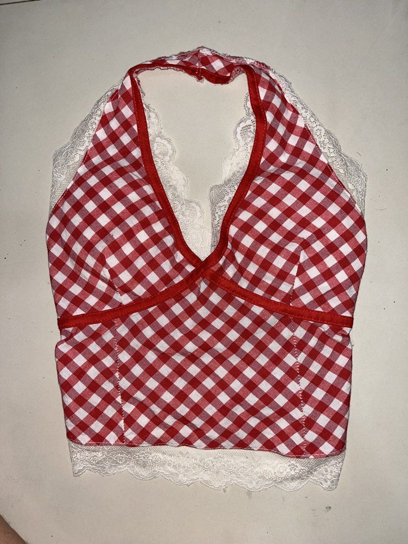 Red White Gingham Halter Crop Top With White Lace and padding (Category: Sleeveless) located in Makati City. Submitted by mei_meiyi (Listing ID 1471187552, Image 1). Description: - Red and white gingham print crop top - Halter neck with a plunging V-neckline - White floral lace trim along the neckline and hem - Great for summer days and casual outings - Easy pullover design -padded. large ko siya nabili pero medyo masikip sa harap na part..