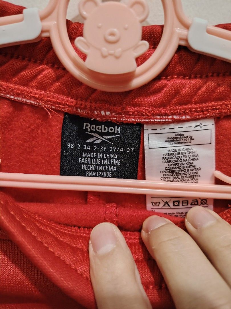 Reebok Red Sweatpants With White Side Stripes Size 2T (Category: Babies & Kids Fashion) located in Makati City. Submitted by jayclutter0976004 (Listing ID 1471208786, Image 3). Description: - Brand new with tags attached (BNWT) - Vibrant bright red color with classic white side stripes - Signature white Reebok logo printed near the hip - Comfortable and secure elastic waistband - Cozy soft fleece lining inside to keep your little one warm.