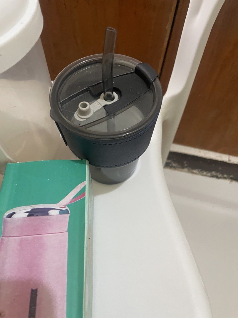 Reusable drinkware, lunch box, and vacuum flask bundle (Category: Water Bottles & Tumblers) located in Manila. Submitted by lovelydiy (Listing ID 1471133066, Image 3). Description: - 4-Piece On-the-Go Bundle (Selling as a set only) - White shaker bottle for your fitness drinks - Dark gray tumbler with straw for easy sipping - Aesthetic cherry blossom lunch box for meals - Pink Nice 400ml vacuum flask (Brand new in box) - Perfect for daily school,
