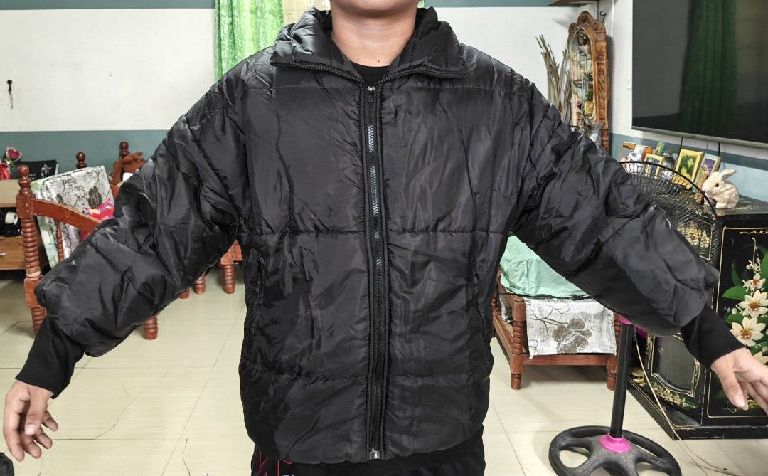 Reversible Puffer Jacket Navy Blue Black Winter Coat (Category: Coats, Jackets and Outerwear) located in Pasig City. Submitted by siyerli8 (Listing ID 1471172318, Image 2). Description: jacket with two distinct looks. One side navy blue horizontal quilted pattern featuring two front pockets with dark trim. Reverse side solid black with horizontal padding. Full front zipper closure. Stand-up collar keeps the neck warm. Lightweight synthetic insula