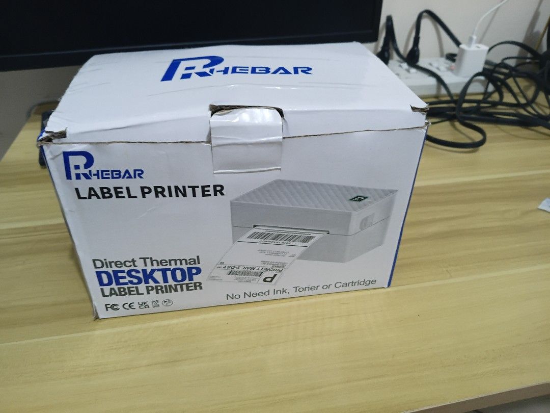 Thermal Label Printer with Thermal Paper (Category: Printers, Scanners & Copiers) located in Pasig City. Submitted by mryln (Listing ID 1471237681, Image 1). Description: - RHEBAR brand - desktop and mobile compatible - Perfect for waybill/ shipping label printing - With power adapter and USB cable - With black label roll holder stand - Includes 4 packs of sealed thermal paper stacks - Original box included pickup loc: Pasig delivery only via cou