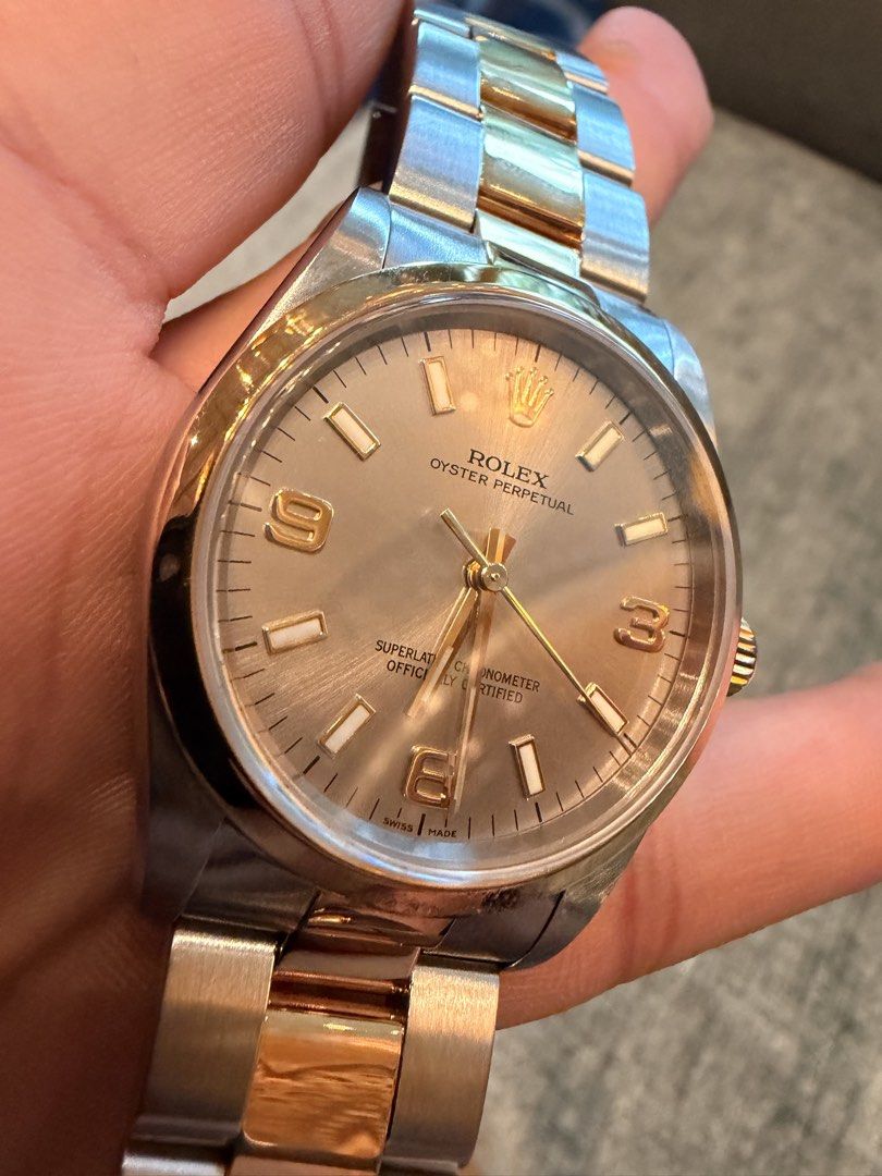 Rolex Oyster Perpetual Two tone (Category: Luxury Watches) located in Manila. Submitted by corte.collection (Listing ID 1471138180, Image 2). Description: ⌚️ wModel / Reference: Oyster Perpetual 34, Ref. 14203—Case Size: 34mm stainless steel case with an 18K yellow gold smooth bezel ⌚️ Dial: Silver dial with applied gold baton markers and Arabic numerals at 3, 6, and 9 o’clock ⌚️Movement: Rolex automatic mechanical movement with COSC chronometer 