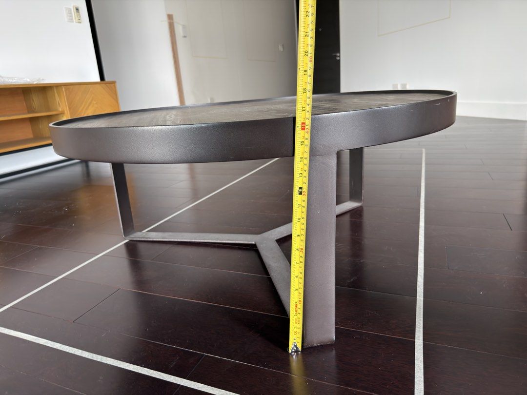 Round Wooden Coffee Table with Steel Base (Category: Tables & Sets) located in Taguig. Submitted by bankysa21 (Listing ID 1471152342, Image 3). Description: Modern Round Wooden Coffee Table with Black Steel Base | 100cm in diameter, 42cm height Selling a modern round wooden coffee table with a sleek black steel base. Features a wood-grain tabletop and sturdy metal frame, making it a stylish yet functional addition to any living room. Dimensions: 