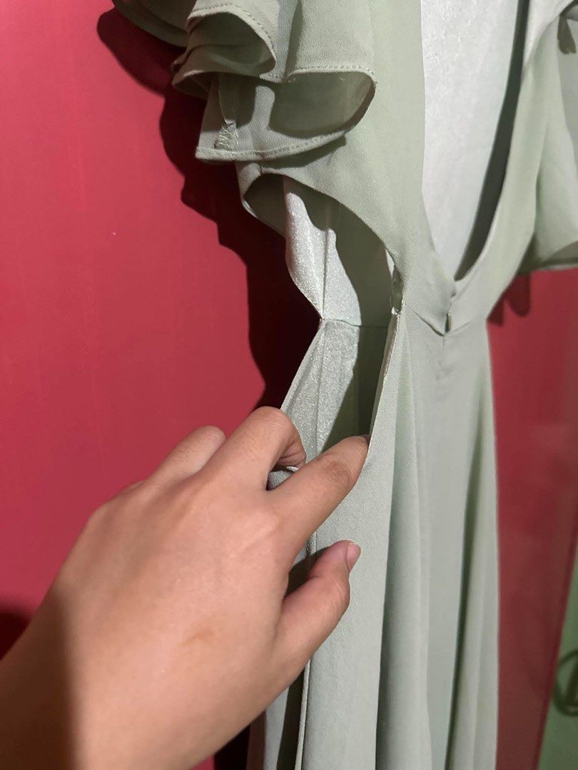 Sage Green Long Gown Backless Dress (Category: Evening dresses & gowns) located in Las Pinas. Submitted by sashimex (Listing ID 1471265741, Image 3). Description: - Color: Sage green - Design: Flared sleeves, low scoop back, and waist cutout details - Skirt: Flowy, full-length silhouette - Fit: Fully lined bodice with a secure lower back zipper closure - Condition: Brand new / Excellent quality (as described) - Perfect for: Weddings, parties, and