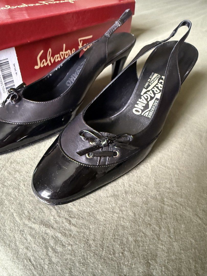 Salvatore Ferragamo Black Slingback Heels with Box (Category: Heels) located in Las Pinas. Submitted by krisclosetus (Listing ID 1471225366, Image 2). Description: - Brand: Salvatore Ferragamo - ETA: Las Piñas City 12/07/2026 - Size: 6 D or 6US - Style: Slingback heels - Color: Black - Material: Leather and patent leather upper - Heel Height: Approx. 3 inches - Details: Small bow on the toe - Origin: Made in Italy - Inclusions: Original red brand