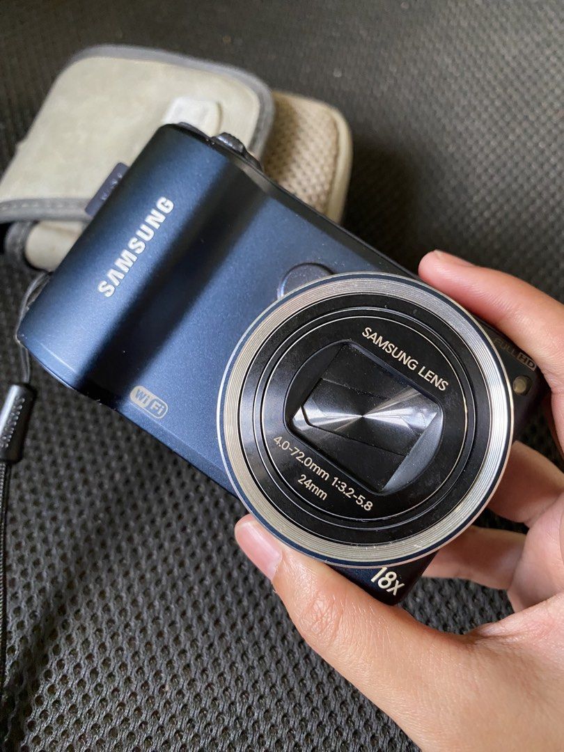 Samsung® WB250F Compact Digital Camera with Case (Category: Cameras) located in Cainta. Submitted by stuff_4_sale_dump (Listing ID 1471197913, Image 3). Description: midnight blue color 18x optical zoom and 24mm wide angle full HD video recording capability built-in Wi-Fi untested, clean body, and scratch-free lens includes original battery and grey protective carry pouch (Canon) issue: battery door doesn’t lock in place, have to had it taped (se