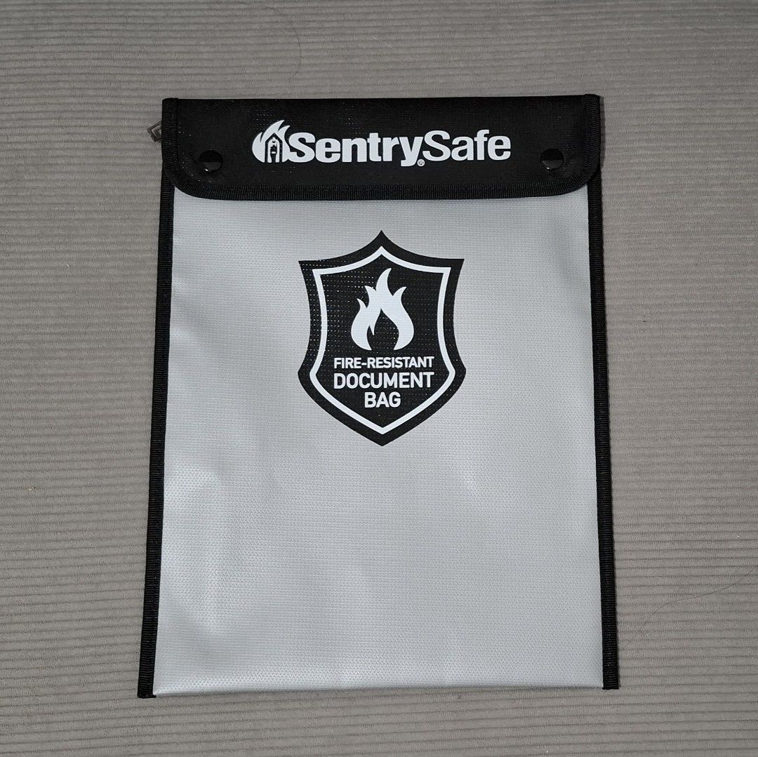 SentrySafe Fire-Resistant Document Bag (15" x 11") (Category: Craft Supplies & Tools) located in Manila. Submitted by grdvoir (Listing ID 1471289926, Image 1). Description: Selling my SentrySafe Fire-Resistant Document Bag, ideal for keeping important documents and other valuables organized and protected. Brand: SentrySafe Type: Fire-Resistant Document Bag Color: Black & Gray/White Approx. size: 15" x 11" Clean and well-maintained Actual item and