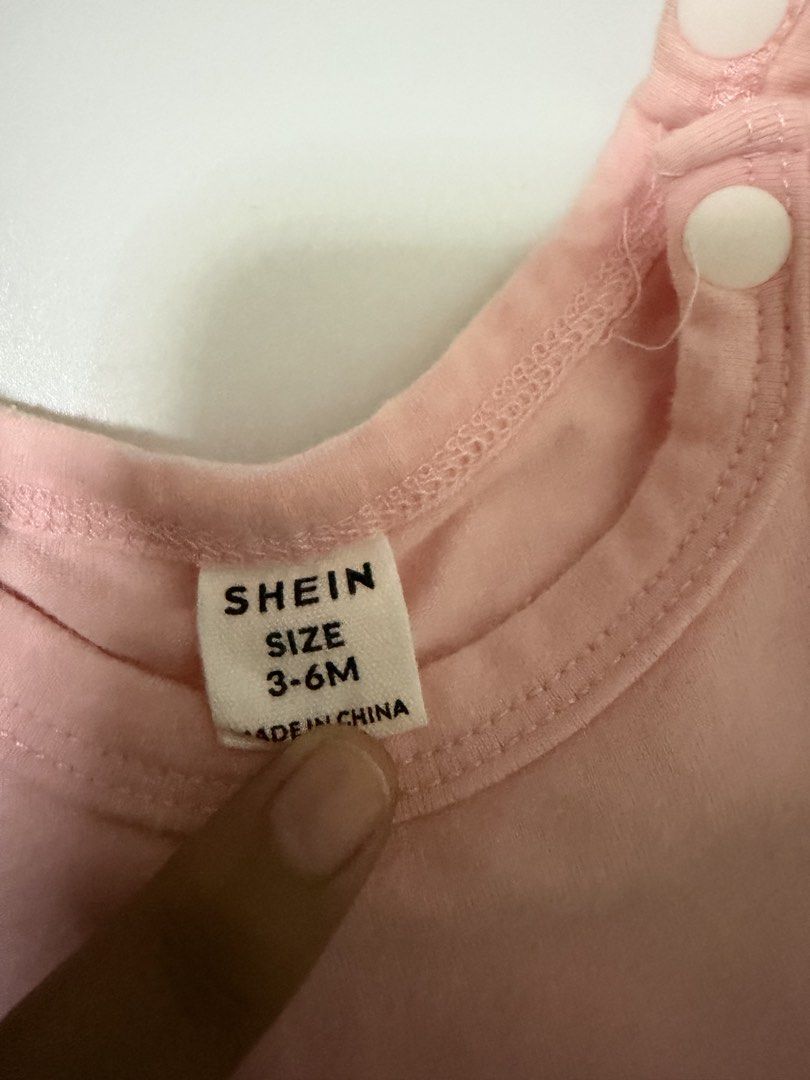 Shein Baby Pink Bunny Romper 3-6M (Category: Babies & Kids Fashion) located in General Santos City (Dadiangas). Submitted by my_lzlove (Listing ID 1471237630, Image 2). Description: - Size: 3-6 months - Brand: Shein - Material: Soft and breathable cotton - Design: Pink romper featuring a cute bunny face with a 3D mesh bow - Details: Ruffle sleeves and ruffled leg openings - Convenience: Snap buttons at the shoulder and bottom for easy diaper chan