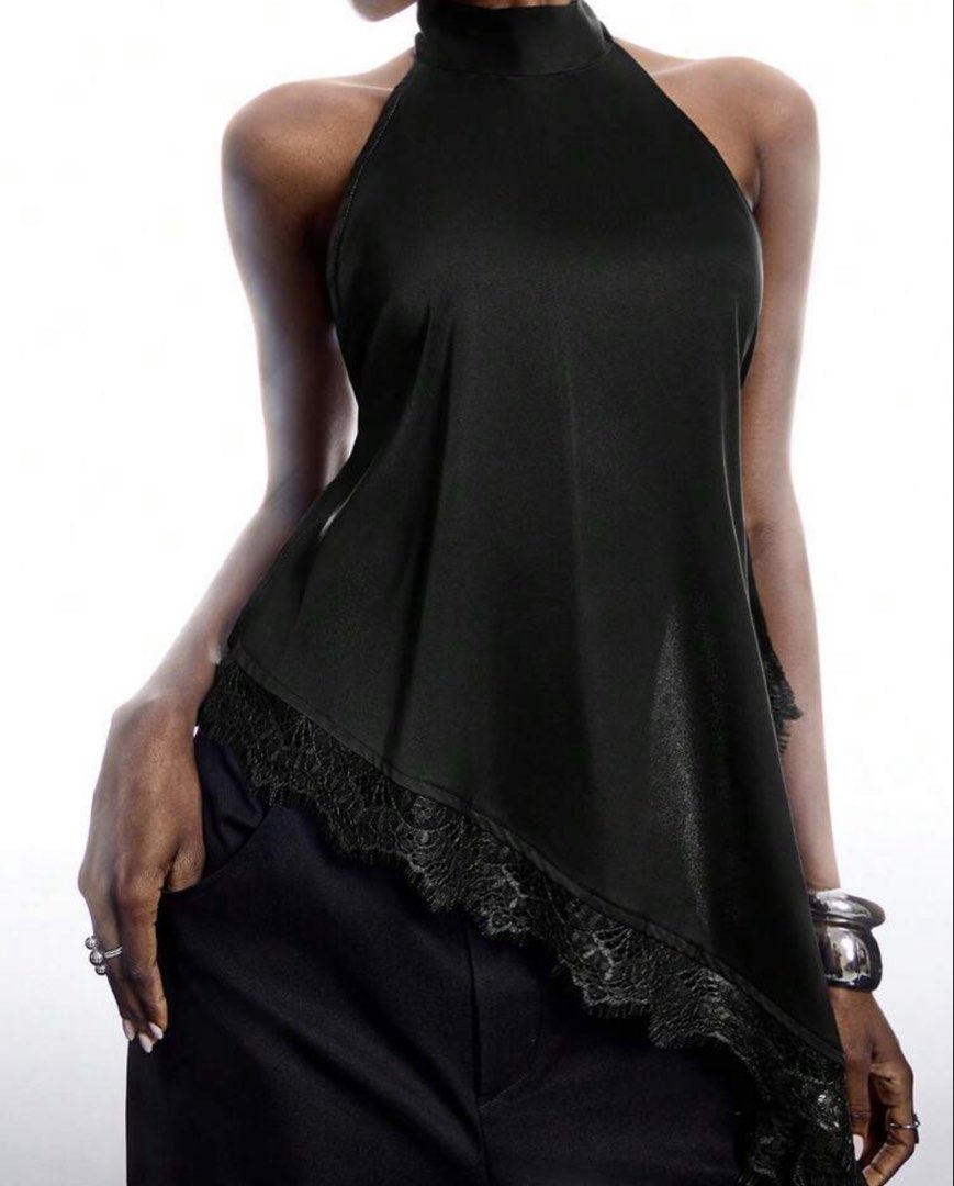 Black Lace Asymmetrical Backless Top (Category: Sleeveless) located in Pasay City. Submitted by declutterwme01 (Listing ID 1471264802, Image 2). Description: USED ONCE FOR PICTORIAL. XS-S (Adjustable strap) Loc: Taft, España GCASH, Via Lalamove STRICTLY NO RETURN OF ITEMS ONCE PURCHASED. PM ME for infos!.