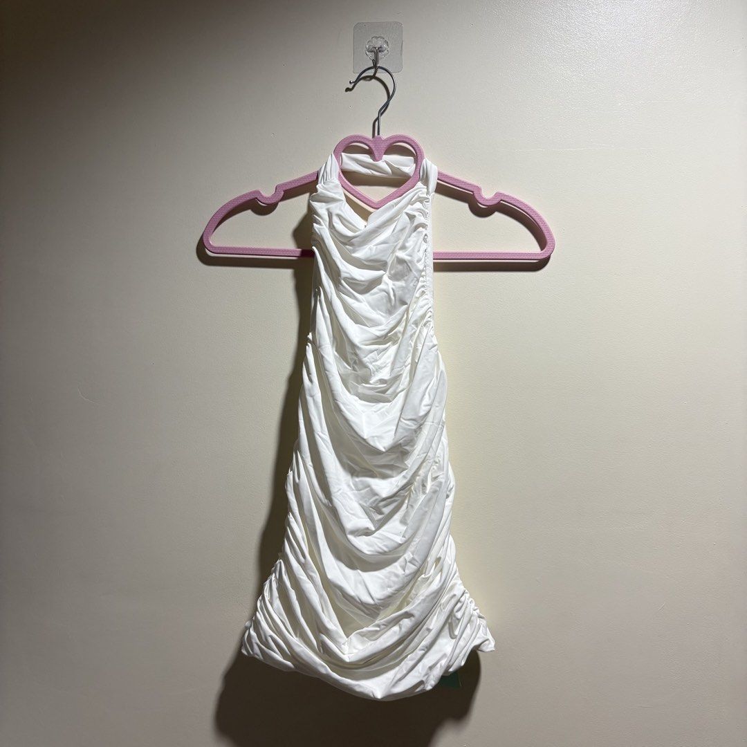 Shein KZN White Ruched Halter Top (Category: Sleeveless) located in Taguig. Submitted by _icedm4tcha (Listing ID 1471292115, Image 1). Description: brand & size: shein (kzn tag) | extra small (xs) color & fabric: solid white double-lined stretch fabric style: bodycon halter neck top all-over front and side ruching condition: brand new with tag (nwt).