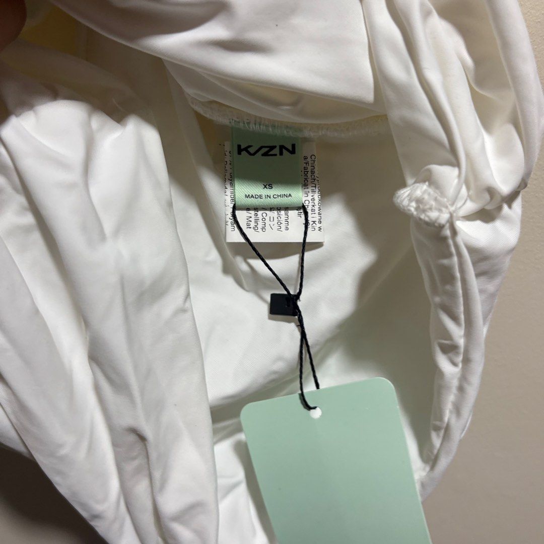 Shein KZN White Ruched Halter Top (Category: Sleeveless) located in Taguig. Submitted by _icedm4tcha (Listing ID 1471292115, Image 2). Description: brand & size: shein (kzn tag) | extra small (xs) color & fabric: solid white double-lined stretch fabric style: bodycon halter neck top all-over front and side ruching condition: brand new with tag (nwt).