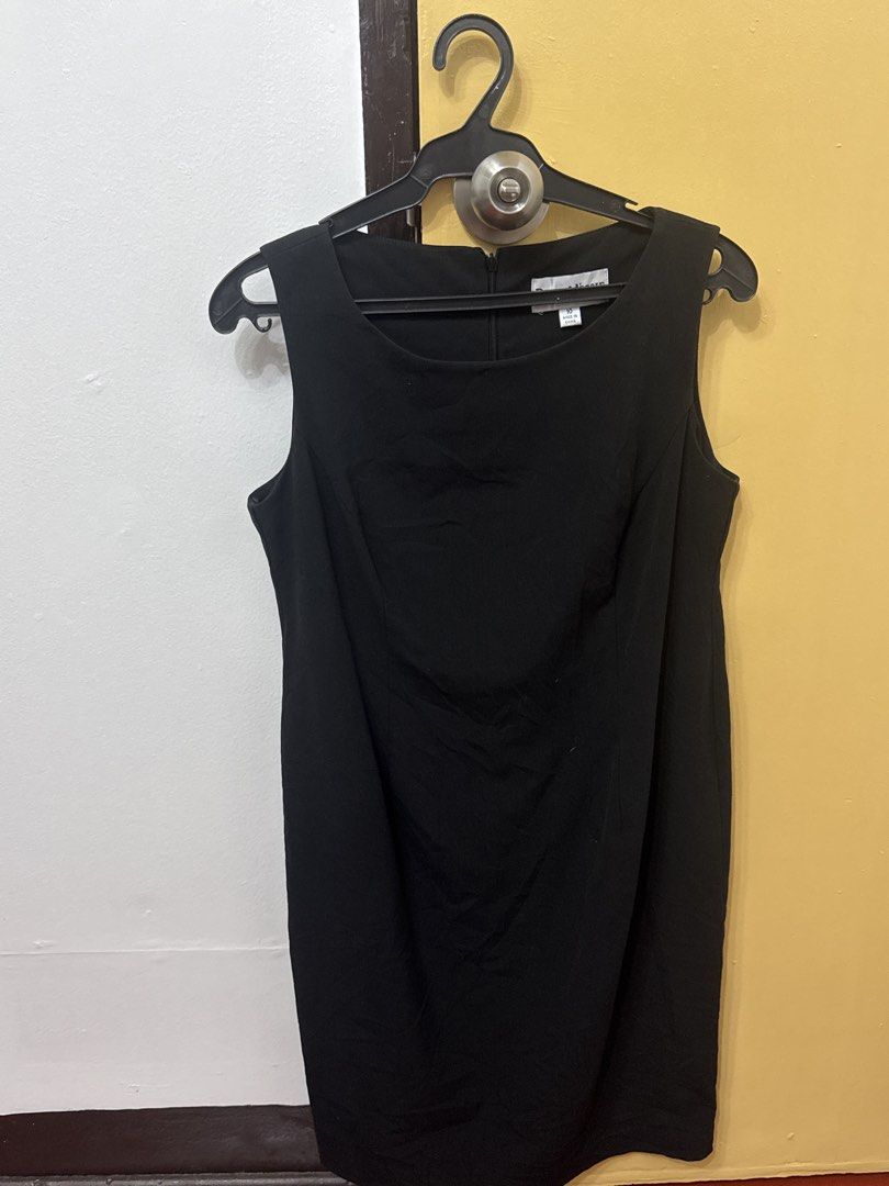 Shift Office Dress (Category: Dresses) located in Cavite. Submitted by luisascloset_ (Listing ID 1471215754, Image 1). Description: - Size: 10 - Color: Solid black - Style: Sleeveless, scoop neckline, knee-length straight cut - Closure: Back zipper - Occasion: Versatile for both work and casual outings - Origin: Made in China.