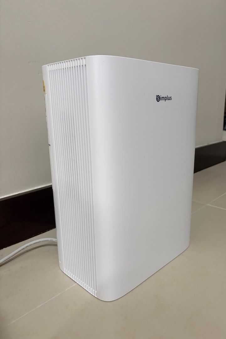 Simplus 2 in 1 Air Purifying Dehumidifier C5 (Category: Air Purifiers & Dehumidifiers) located in Mandaluyong City. Submitted by leypadilla (Listing ID 1471182067, Image 2). Description: - Brand: Simplus 2-in-1 Air Purifying Dehumidifier - Condition: Clean and undamaged, ready to use - Capacity: 750mL per day with a 1.5L water tank - Safety: Auto shut-off function included - Design: Modern vertical white finish with side instruction sticker - Pow
