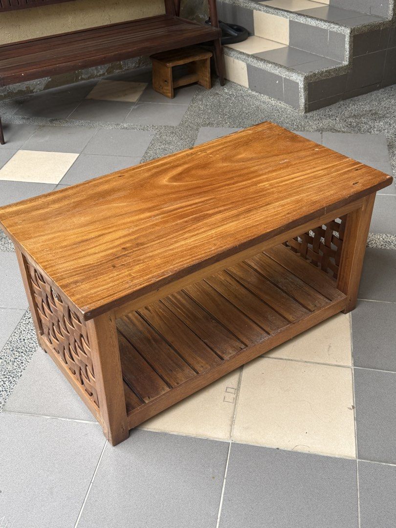 Solid Wooden Coffee Table with Storage Shelf (Category: Tables & Sets) located in Quezon City. Submitted by vg.ph (Listing ID 1471151518, Image 1). Description: For sale: Solid Wood Center Table ₱2,500.00 - Material: Rich brown solid wood with gorgeous natural grain patterns - Storage: Convenient lower slattered shelf for magazines and essentials - Design: Unique woven lattice design on the side panels - Build: Sturdy, heavy-duty structure built 