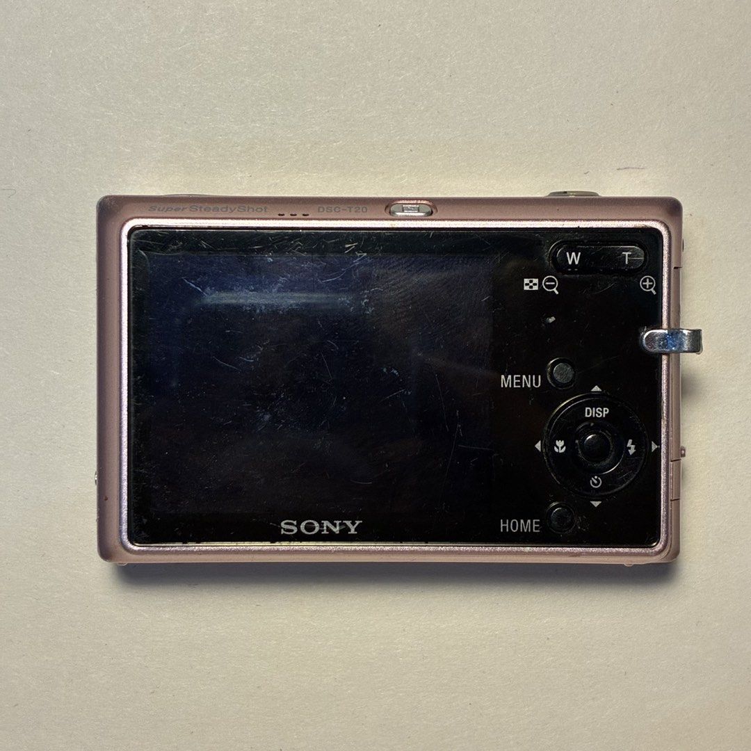 Sony Cyber-shot DSC-T20 Pink Digital Camera (Category: Cameras) located in Manila. Submitted by cedricksimbol7 (Listing ID 1471281398, Image 2). Description: Rare Sony Cyber-shot DSC-T20 (8.1 MP) Metallic Pink Tested and Working: - Smooth sliding cover for the lens - Working built-in flash and Super SteadyShot - English - Nostalgic Video & Audio (DM for Sample) Cosmetics: - Rare pastel metallic pink body with cute sticker accents (can be removed 